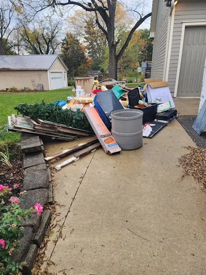 Dumpster being loaded with debris for Roofing Dumpster Rental in Ralpho